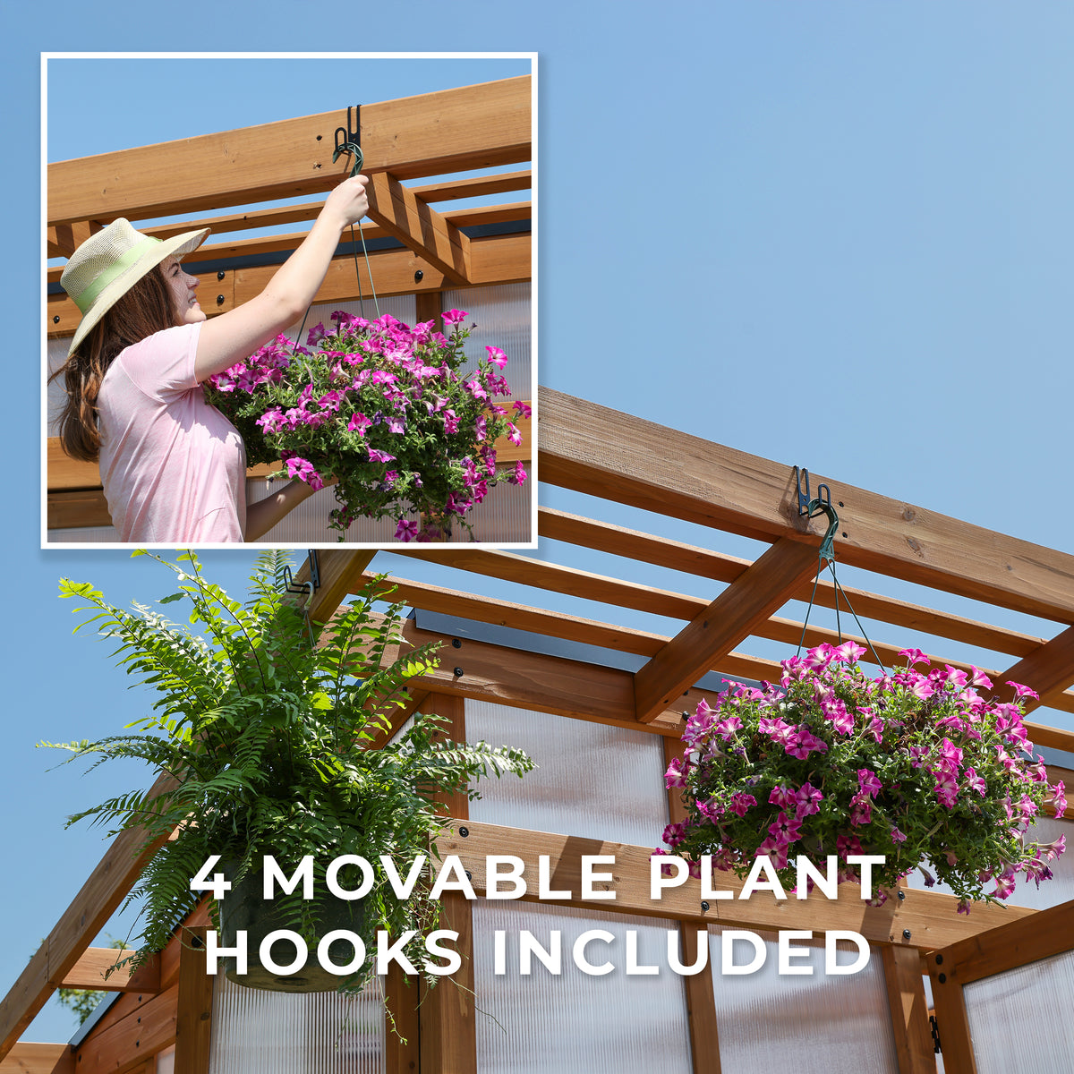 Woman hanging a basket of pink flowers on a movable hook that's included with the Poppy walk-in greenhouse.