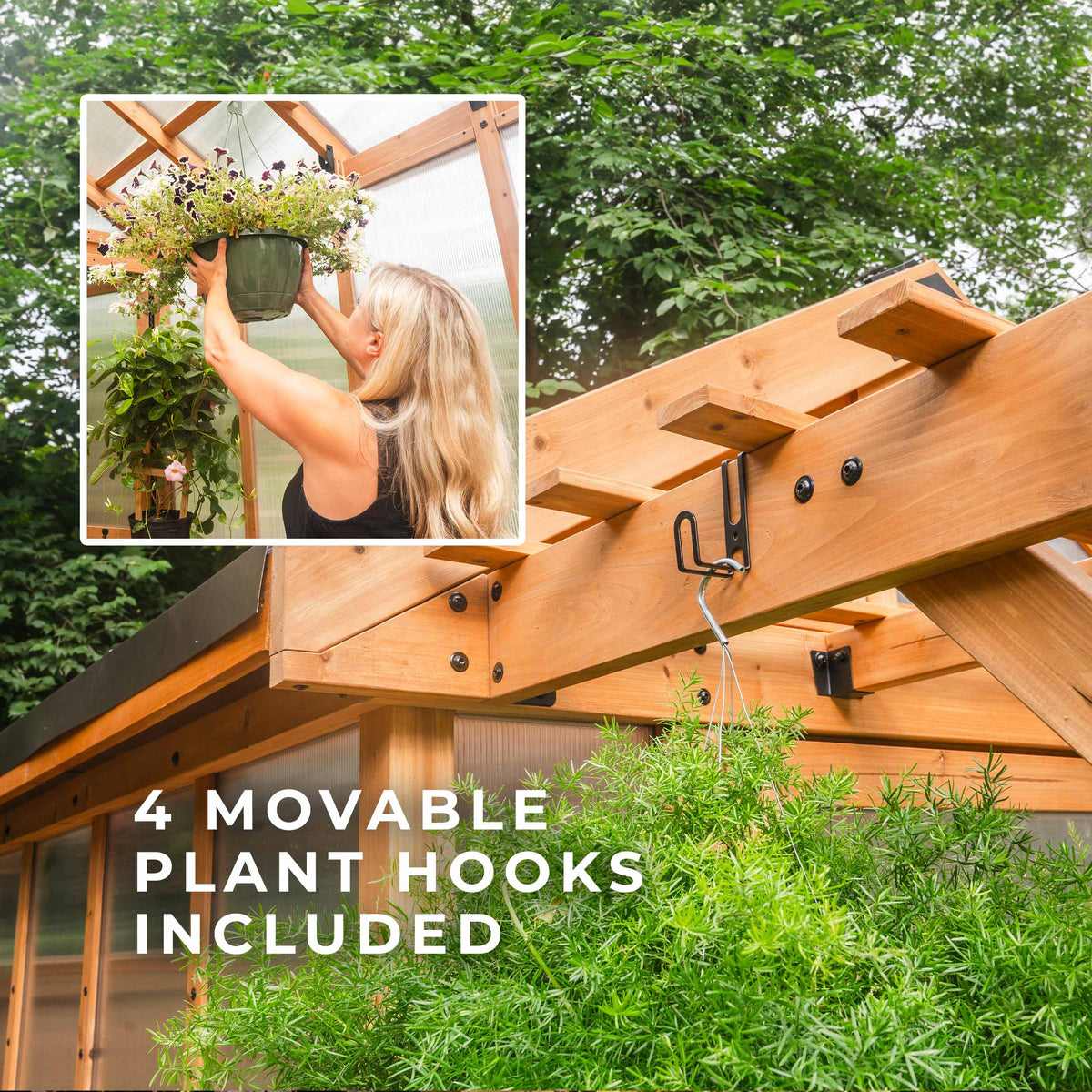 Outdoor greenhouse roof with movable black plant hooks and woman hanging a flowering basket.